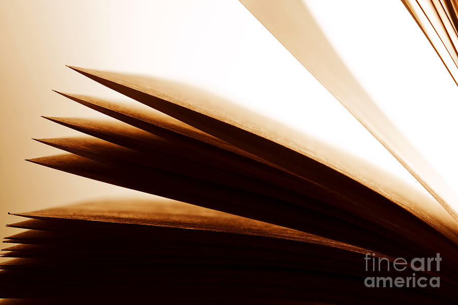 Open old book with pages fluttering #1 Photograph by Michal Bednarek