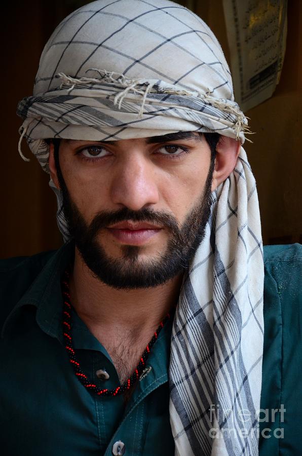 Pakistani Pashtun man models with headscarf and necklace Peshawar Pakistan #2 Photograph by Imran Ahmed