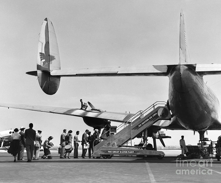 Passengers Boarding A Plane #1 Photograph by C.S. Bauer/ClassicStock