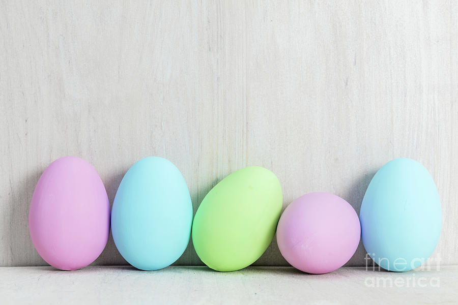Pastel Easter eggs on wooden table. #1 Photograph by Michal Bednarek