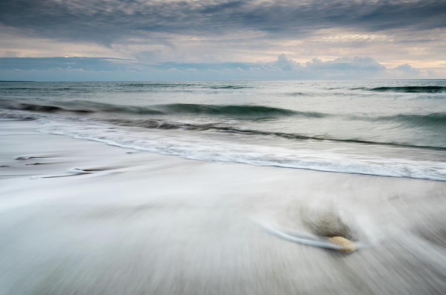 Pebbles in the beach and flowing sea water #1 Photograph by Michalakis Ppalis