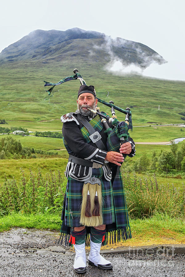 Playing bagpiper Photograph by Patricia Hofmeester