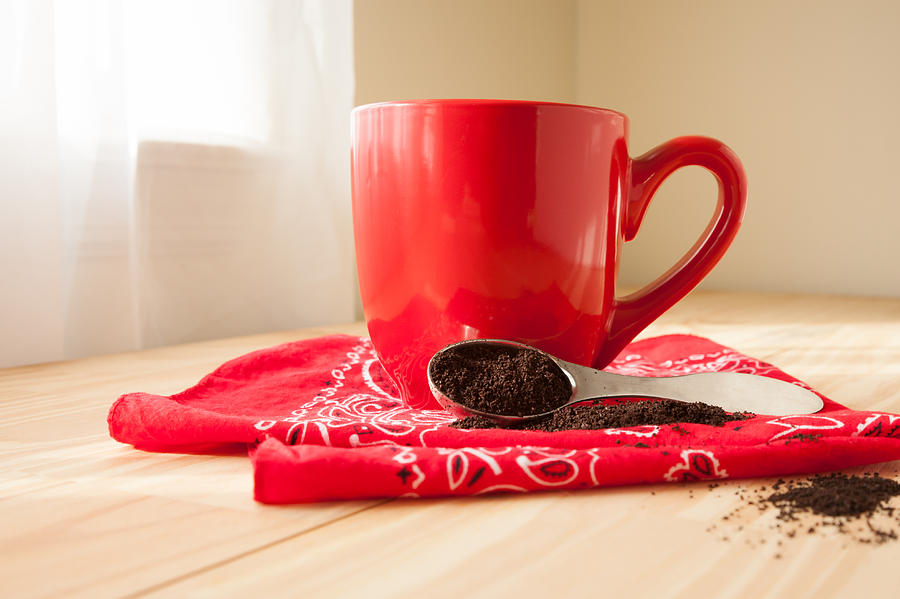 Red Coffee Mug with Napkin and Grounds #1 Photograph by Erin Cadigan