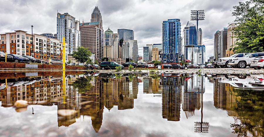 Reflecting Charlotte North Carolina Skyline In The Puddle After  #1 Photograph by Alex Grichenko