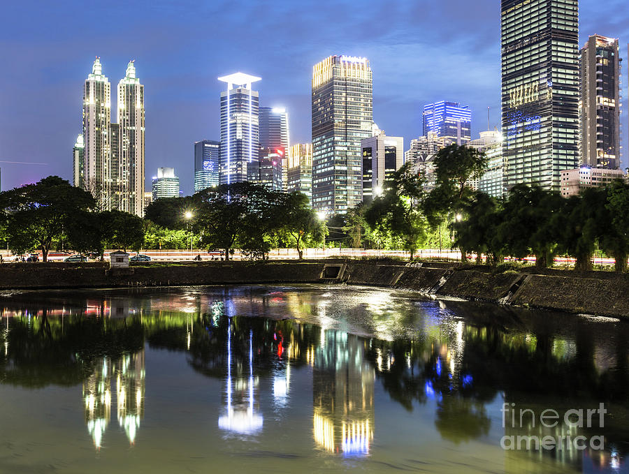 Reflection of Jakarta business district skyline during blue hour #1 Photograph by Didier Marti