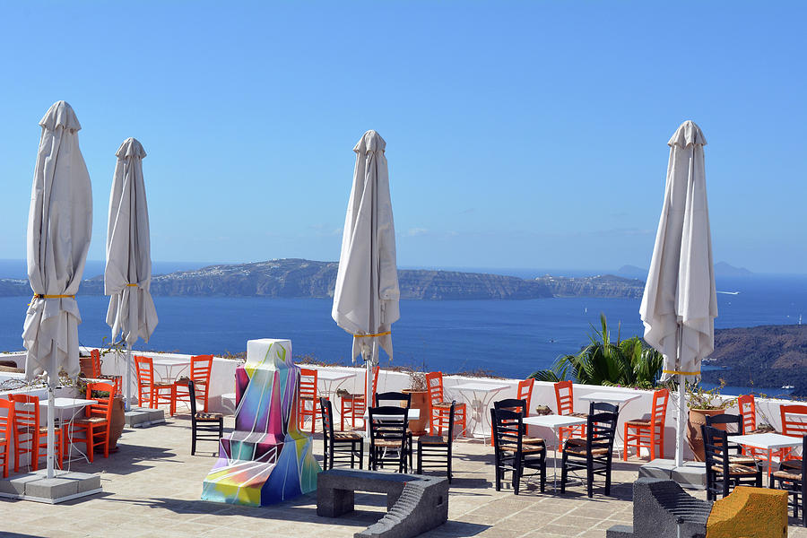 Greek Photograph - Restaurant by the Aegean Sea  in Santorini, Greece  #1 by Oana Unciuleanu