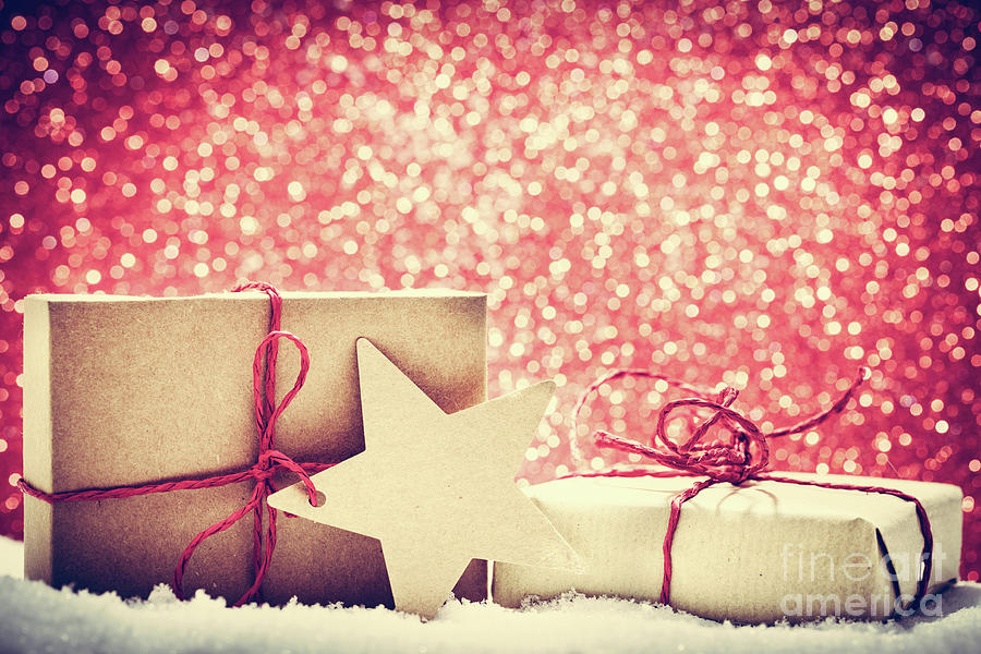 Retro rustic Christmas gifts, presents in snow on glitter background #1 Photograph by Michal Bednarek