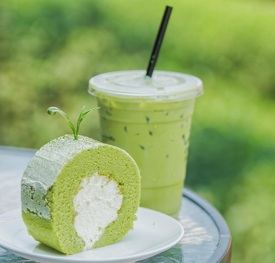 Roll cake and ice green tea #1 Photograph by Anek Suwannaphoom