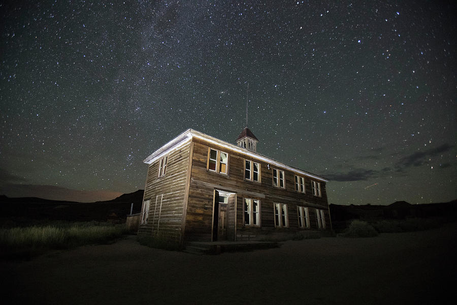 Schoolhouse illuminated in Bodie, California at night #1 Photograph by Karen Foley