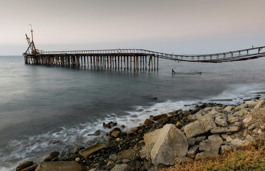 Seascape with deserted jetty during sunset #1 Photograph by Michalakis Ppalis