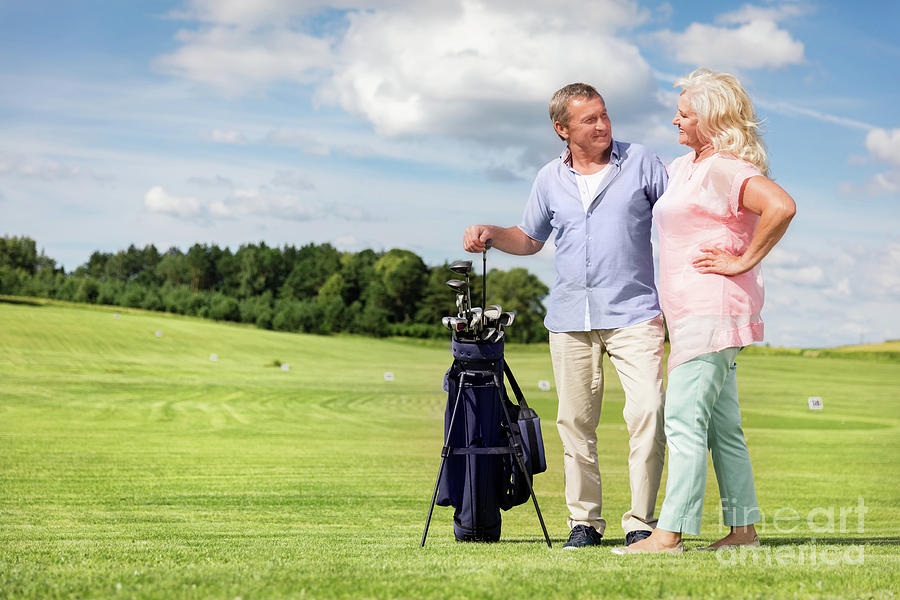 Senior couple enjoying golf game. #1 Photograph by Michal Bednarek