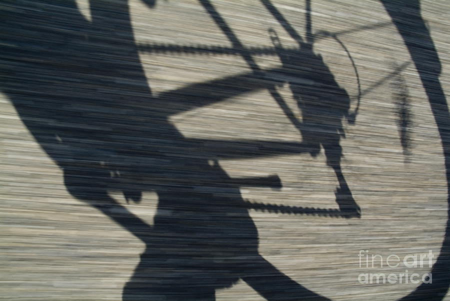 Shadow of a person riding a bicycle #1 Photograph by Sami Sarkis