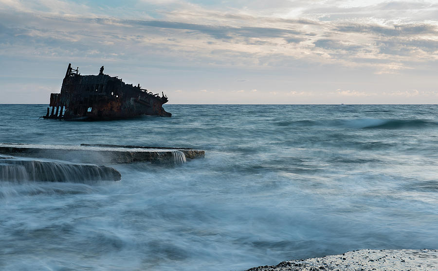 Shipwreck of an abandoned ship on a rocky shore #3 Photograph by Michalakis Ppalis