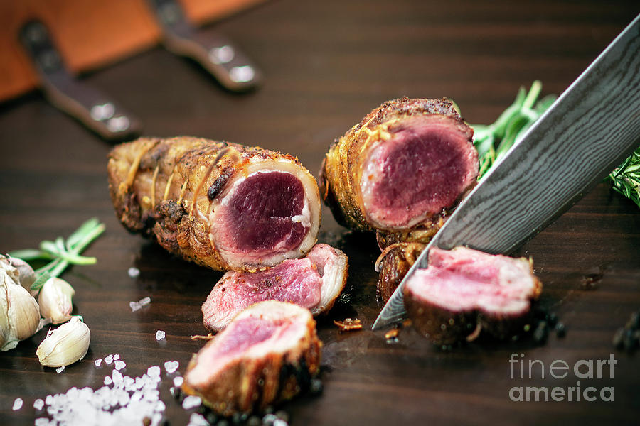Slicing Organic Roast Beef Roll On Wood Table With Ingredients #1 Photograph by JM Travel Photography