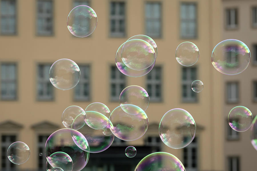 Soap Bubbles In Front Of An Old House Photograph