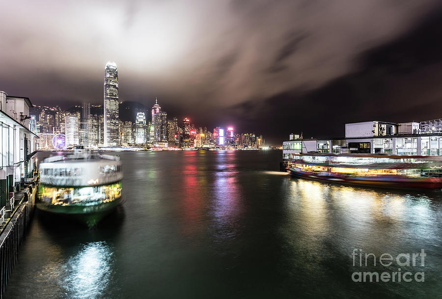 Star ferry building in Hong Kong at night #1 Photograph by Didier Marti