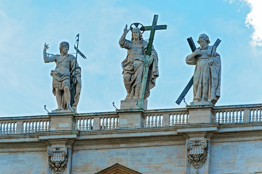 Statues above St. Peter Basilica in Rome. #1 Photograph by Marek Poplawski