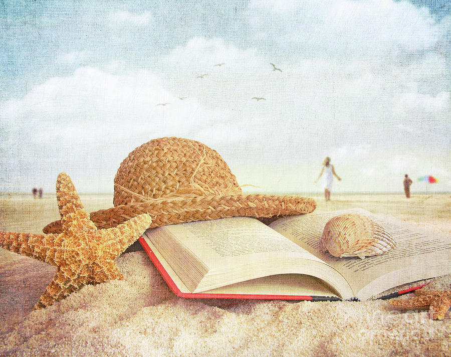 Straw hat book and seashells in the sand #1 Photograph by Sandra Cunningham
