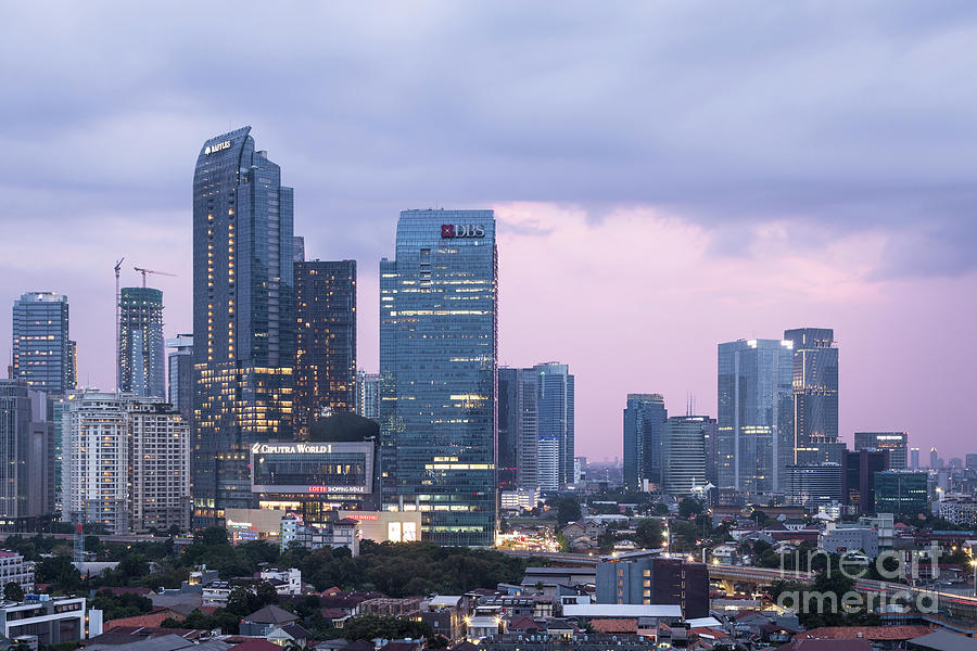 Sunset over Jakarta business district in Indonesia capital city. #1 Photograph by Didier Marti