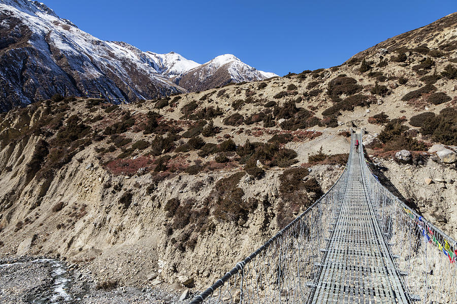 Suspension bridge along the Annapurna circuit trek #1 Photograph by Didier Marti
