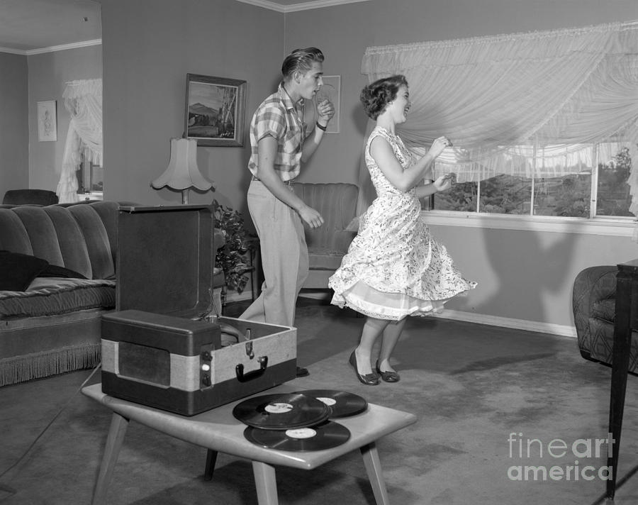 Teen Couple Dancing At Home, C.1950s #1 Photograph by Debrocke/ClassicStock