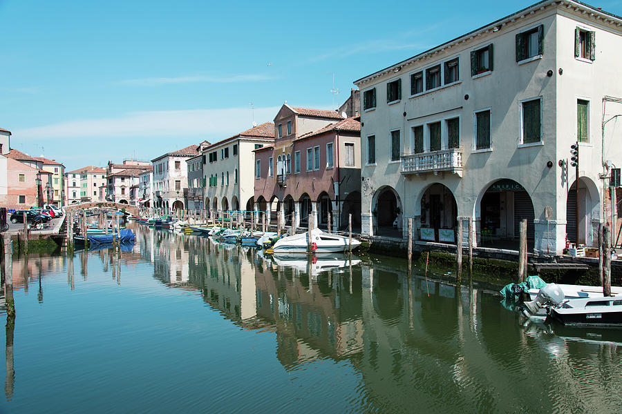 The canals of Chioggia, the small Venice. Reflections on the water ...