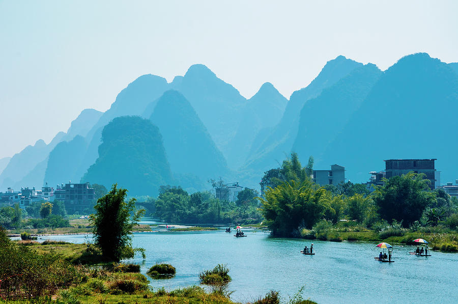 The karst mountains and river scenery #1 Photograph by Carl Ning