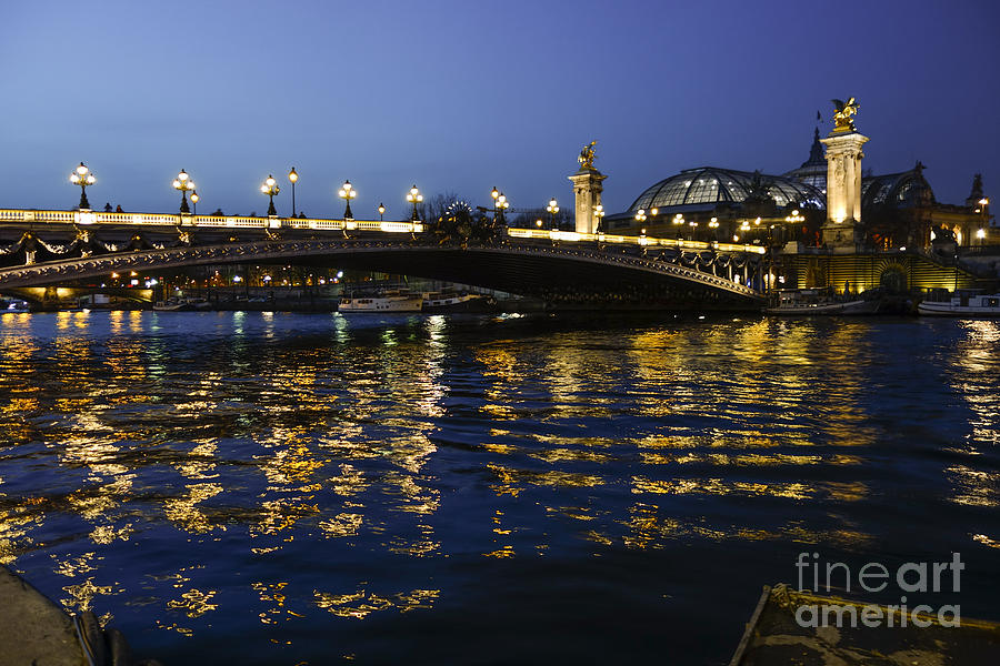 The Pont Alexandre III, arch bridge in Paris at night, Grand Palais behind, France. #1 Photograph by Perry Van Munster