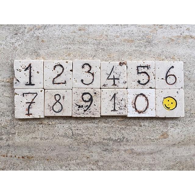 Concept Photograph - 1 To 10 Numbers On Carved Travertine by Adriano La Naia
