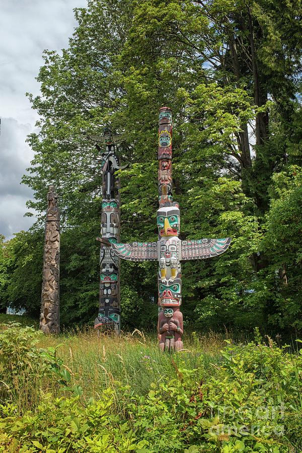 Totem poles in Stanley Park, Vancouver Photograph by Patricia Hofmeester