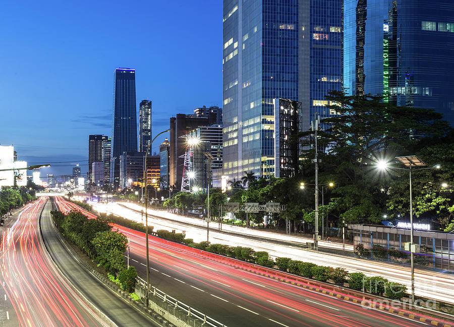 Traffic light trails in Jakarta business district in Indonesia c #1 Photograph by Didier Marti