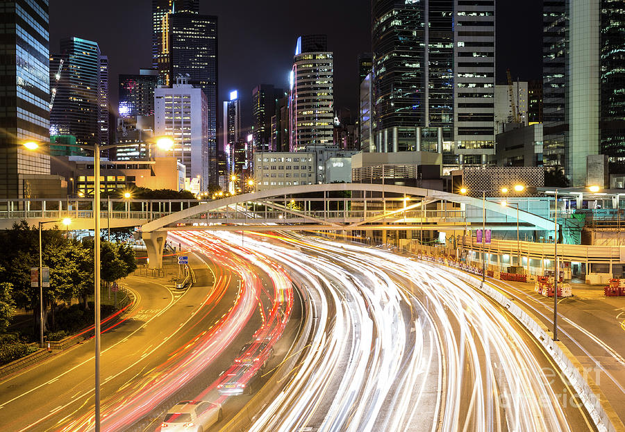 Traffic rushing in in the Central business district in Hong Kong #1 Photograph by Didier Marti