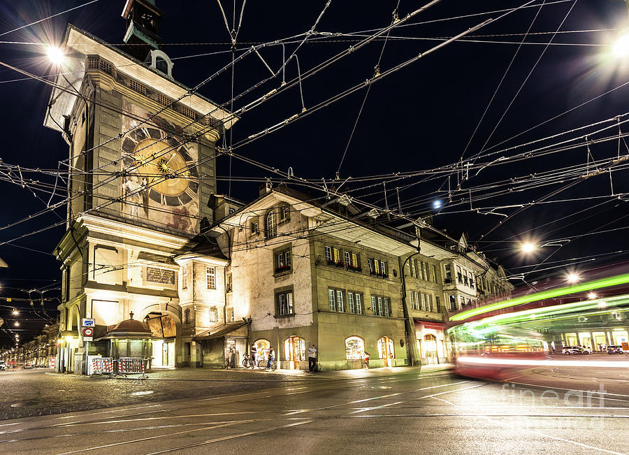 Tram rushes at night in Bern, Switzerland capital city #1 Photograph by Didier Marti