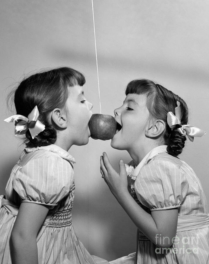 Twin Girls Bobbing For Apple #1 Photograph by H. Armstrong Roberts/ClassicStock
