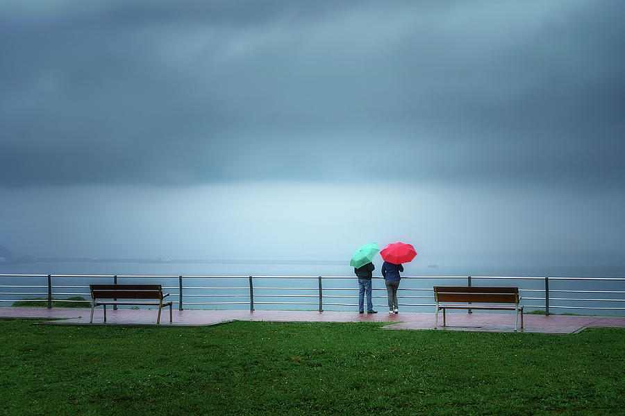 Two Person With Colorful Umbrellas  #1 Photograph by Mikel Martinez de Osaba