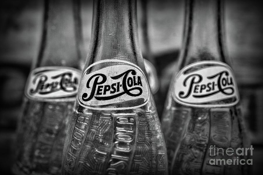 Two Vintage Pepsi Bottles in black and white #1 Photograph by Paul Ward