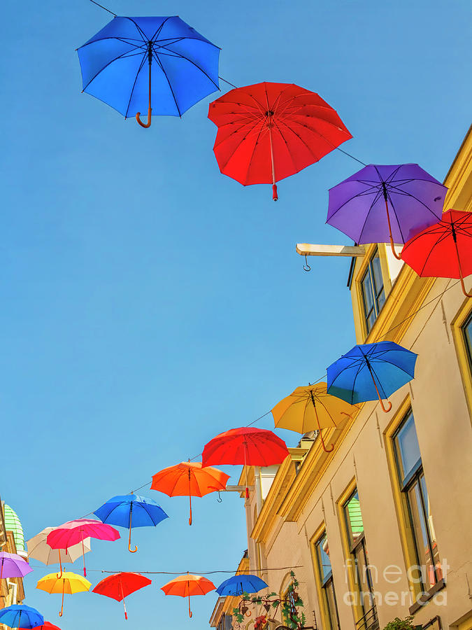 Umbrellas in the sky Photograph by Patricia Hofmeester