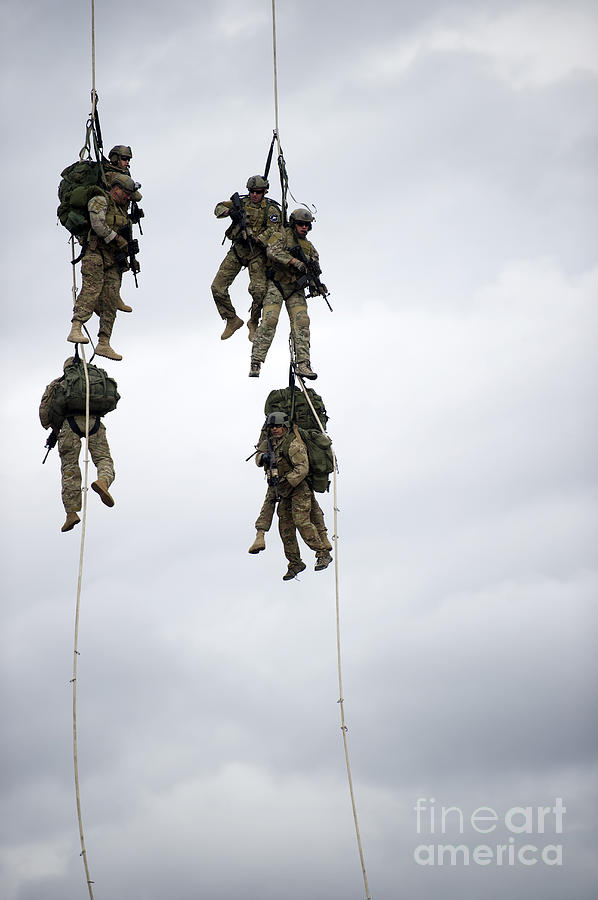 U.s. Soldiers Are Lifted Off The Ground Photograph by Stocktrek Images