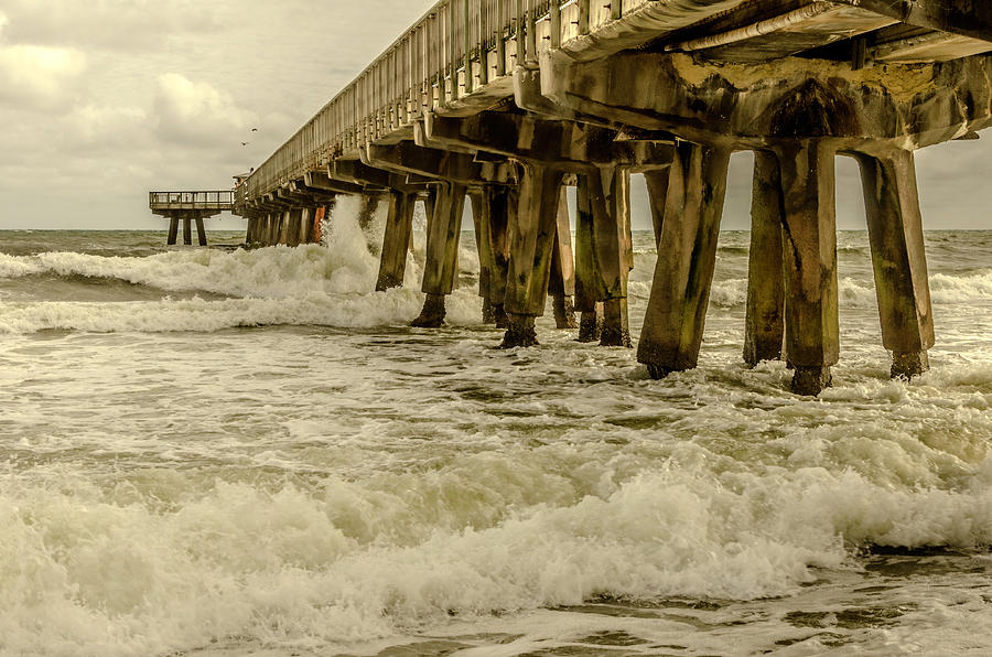 Waves hit the pier #1 Photograph by Wolfgang Stocker