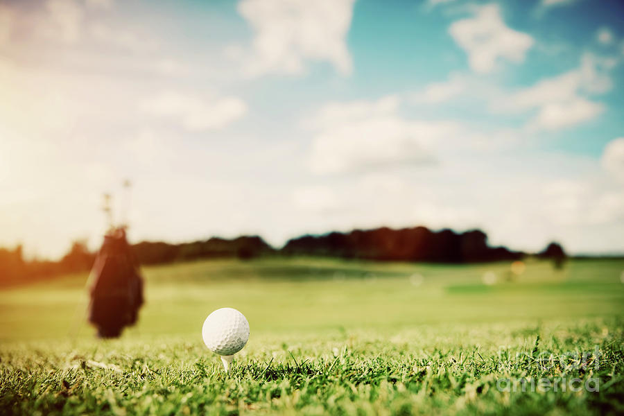Golf Photograph - White golf ball on a green grass #1 by Michal Bednarek