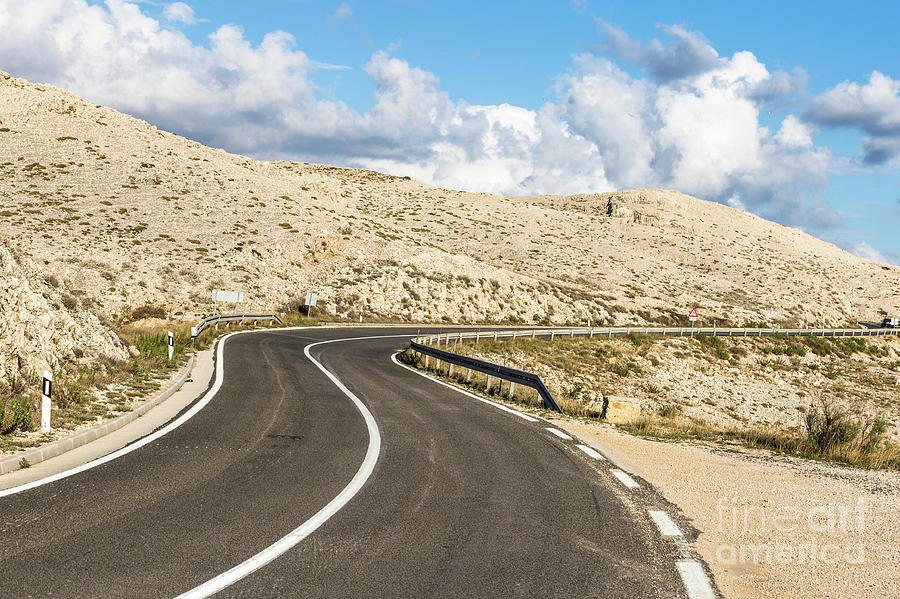 Winding road on the Pag island in Croatia #1 Photograph by Didier Marti