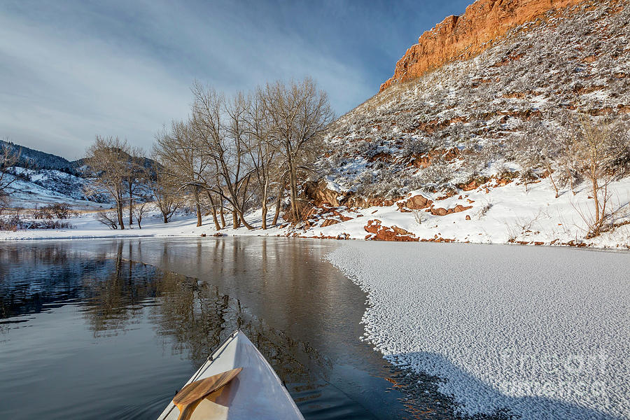winter canoe paddling in Colorado #1 Photograph by Marek Uliasz