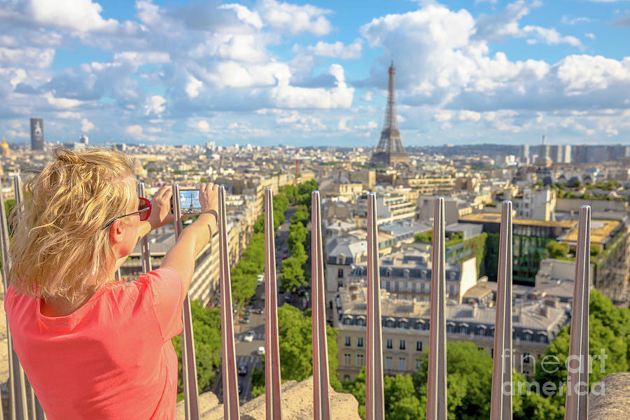 Woman photographs Eiffel Tower #1 Photograph by Benny Marty