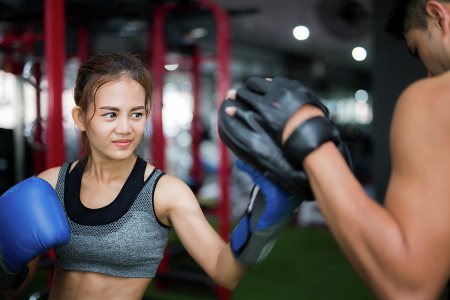 Woman ttaining for Fitness boxing #1 Photograph by Anek Suwannaphoom