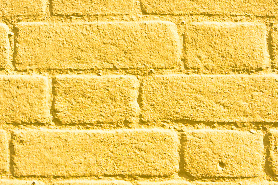 Abstract Photograph - Yellow brick wall #1 by Tom Gowanlock
