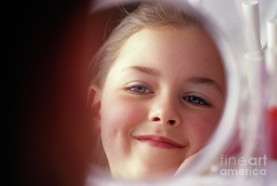 Young Girl Smiling in Mirror #1 Photograph by Jim Corwin