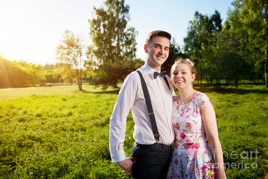 Young happy couple in love portrait in summer park #1 Photograph by Michal Bednarek