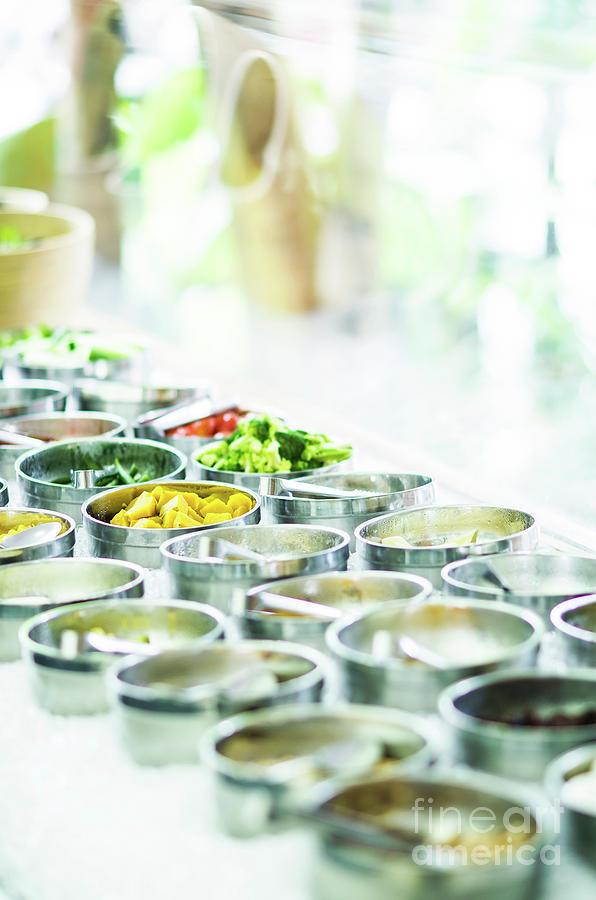 Bowls Of Mixed Fresh Organic Vegetables In Salad Bar Display