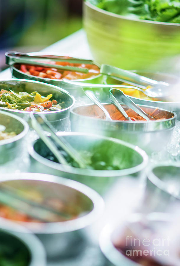 Bowls Of Mixed Fresh Organic Vegetables In Salad Bar Display