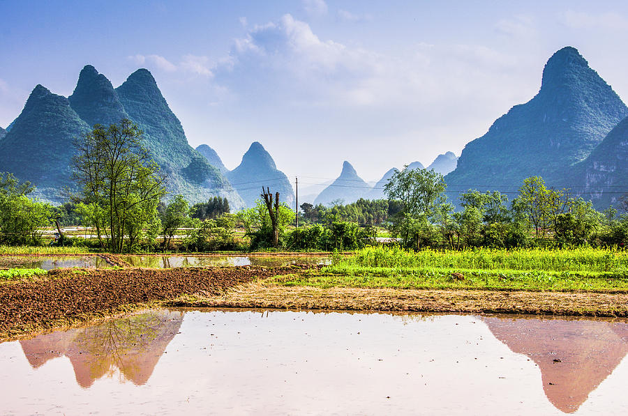 Karst mountains and rural scenery Photograph by Carl Ning - Fine Art ...